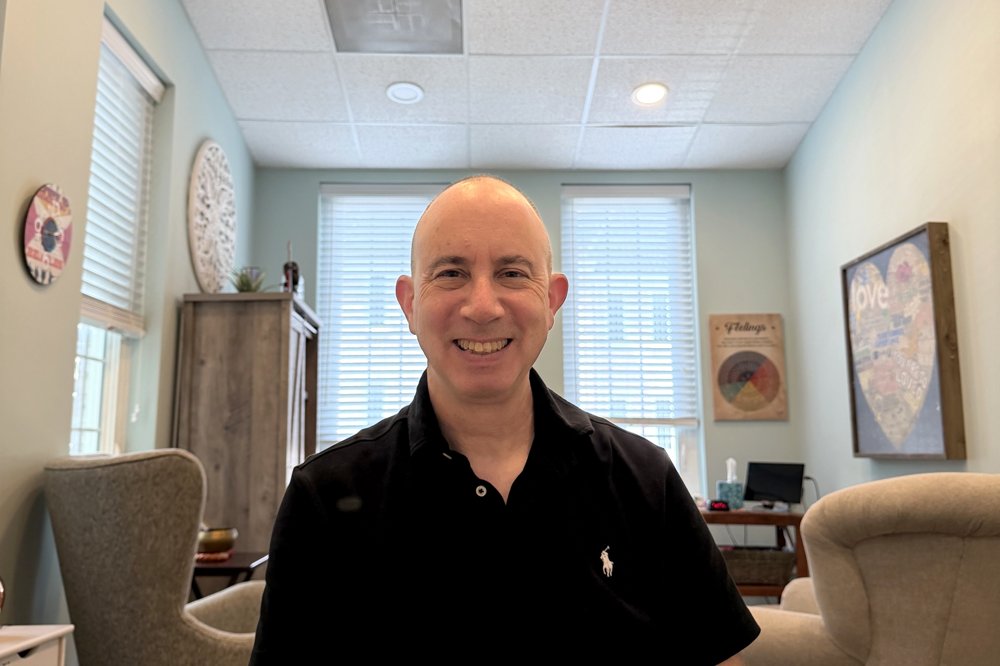 Alan Pachter seated in his office